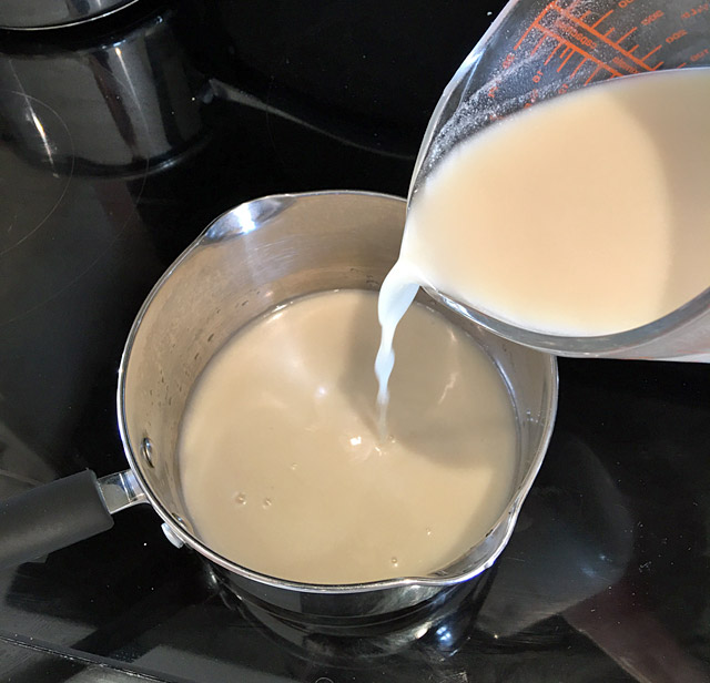 pour almond milk into pan